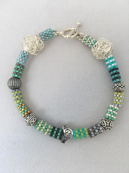 Beaded bead and sterling silver bracelet