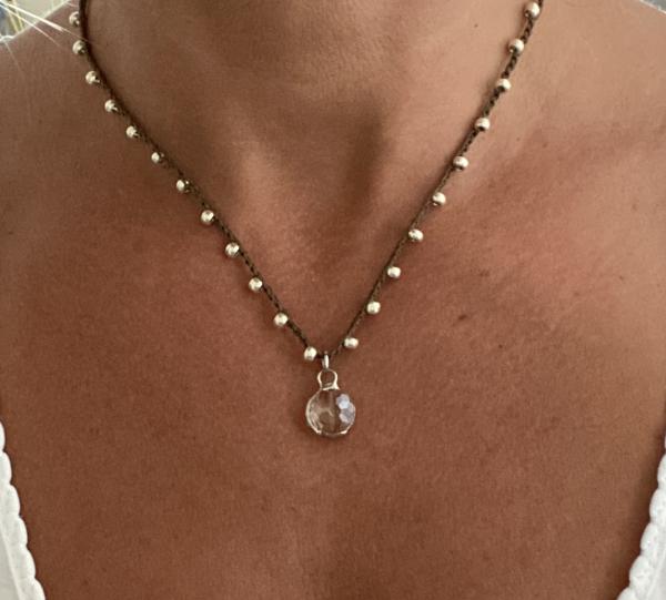 Tiny crystal pendant on crochet chain picture