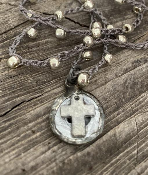 Tiny cross pendant on crochet chain picture