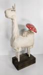 Llama with red mushroom