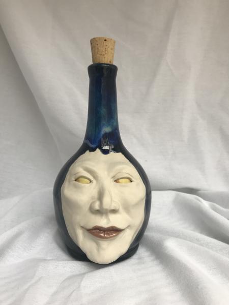 Ceramic face bottle picture