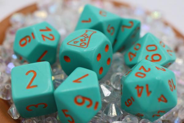 Chessex: Lab Dice 4 - Heavy Turquoise with Orange picture