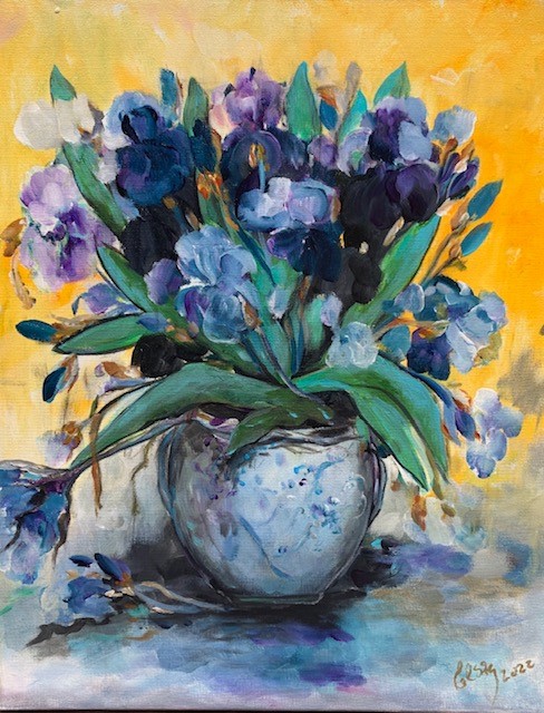 Irises in blue vase