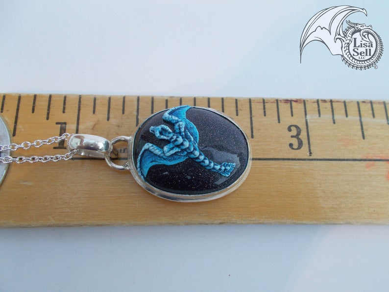 Blue Dragon on Very Sparkly Dark Gold Stone Pendant picture
