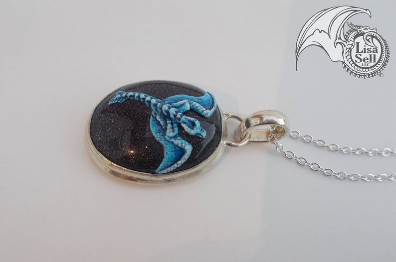 Blue Dragon on Very Sparkly Dark Gold Stone Pendant picture