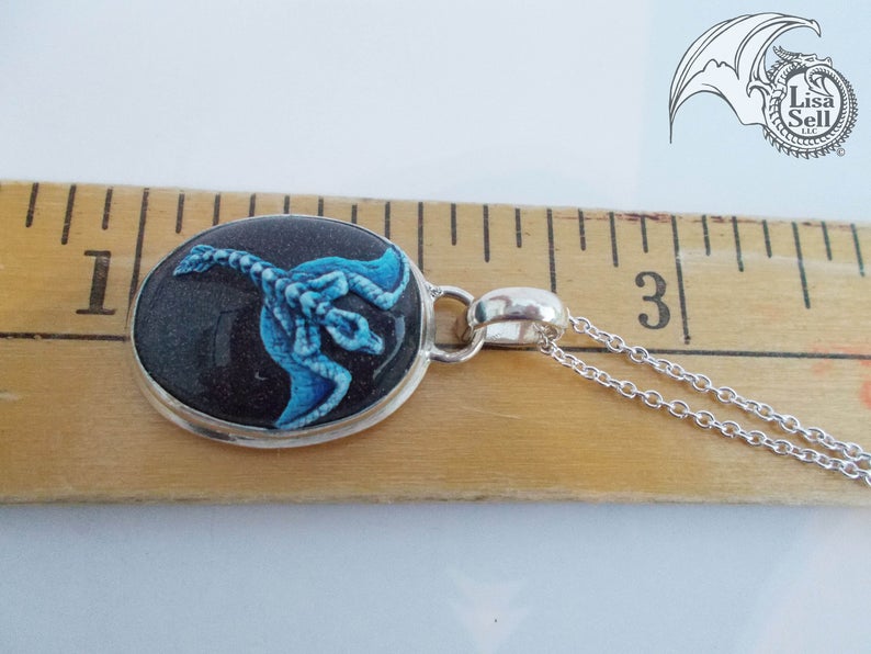 Blue Dragon on Very Sparkly Dark Gold Stone Pendant picture